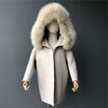 A beige cashmere and fur kid coat designed by MVFURS.