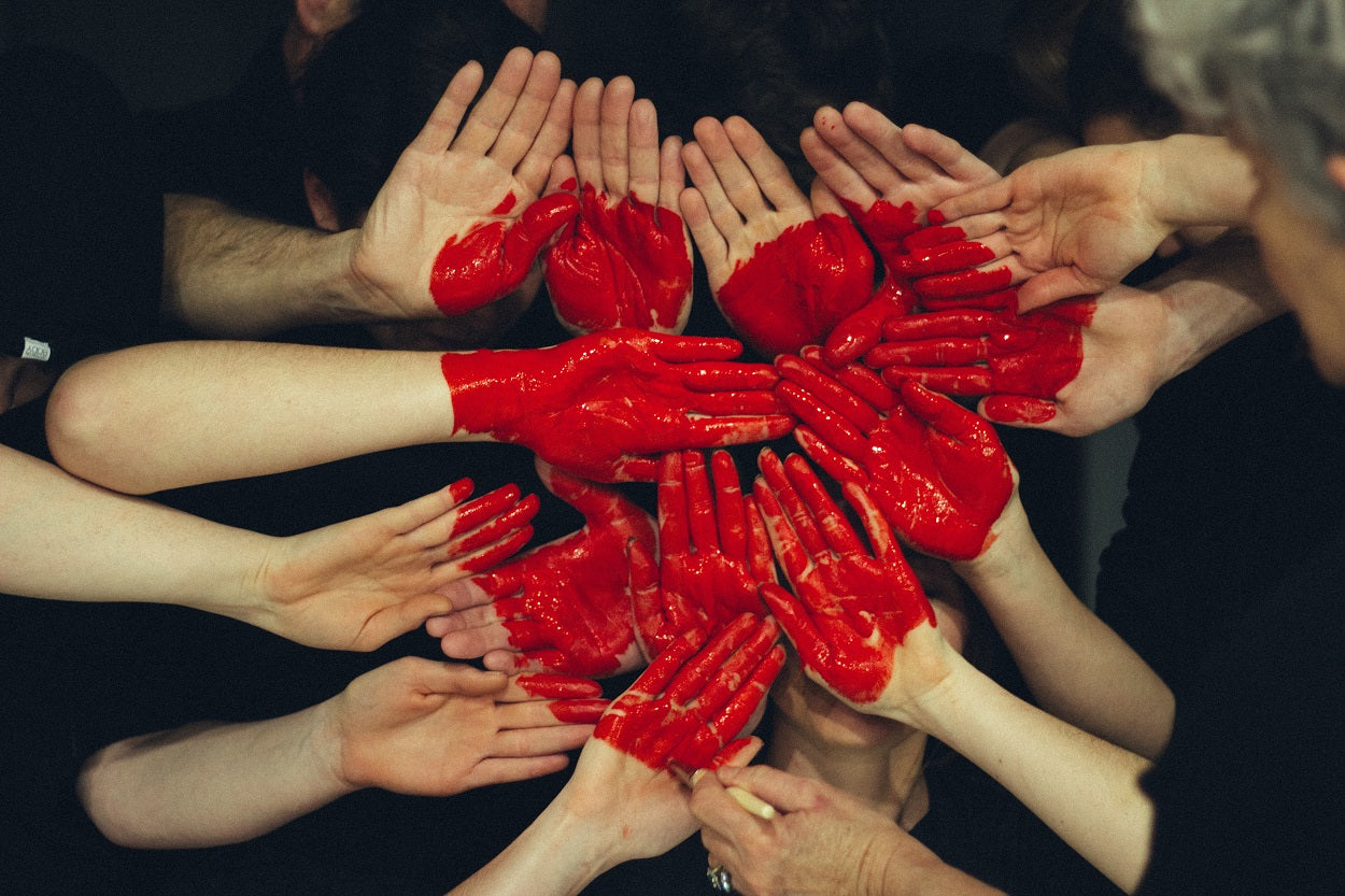 Hands painted with red-Preserving Culture-Shaka Tribe