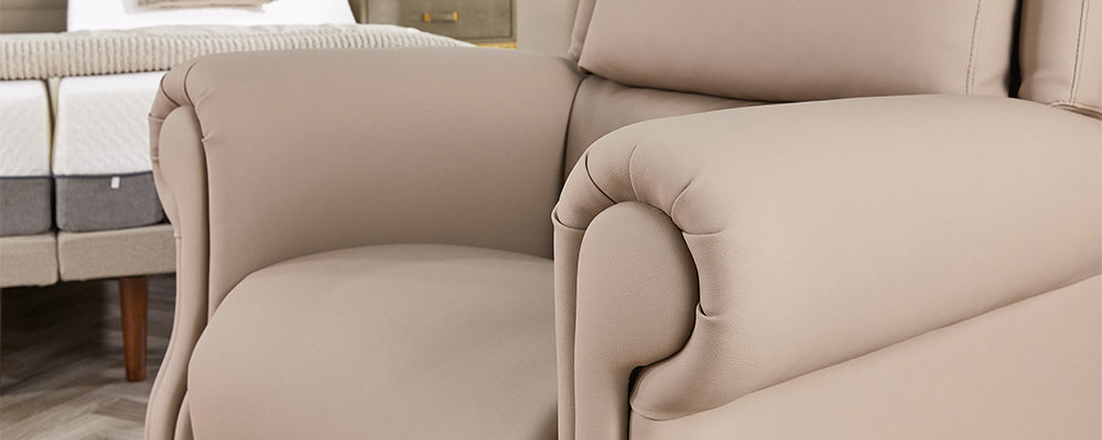 A close up of a cream leather riser recliner chair