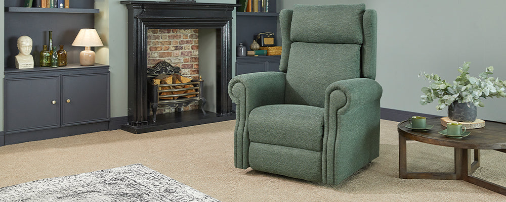 A green riser recliner chair with waterfall back cushions