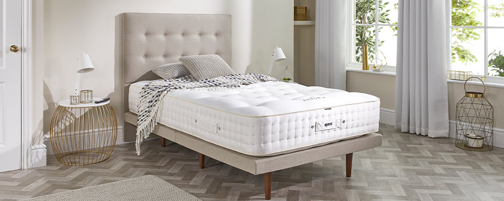 A linen adjustable bed with an Opera Emporia sprung mattress ontop