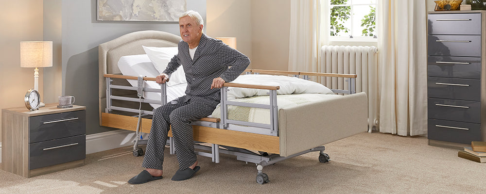 this is an elderly man getting out of bed by himself using the rails on the bed to help him
