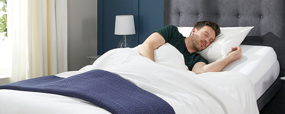 Man sleeping in bed with his head raised