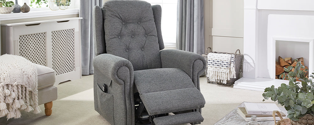 A grey button back riser recliner chair