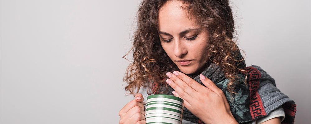 Woman holding a green mug