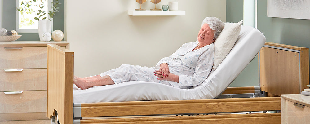 lady sleeping in a care bed