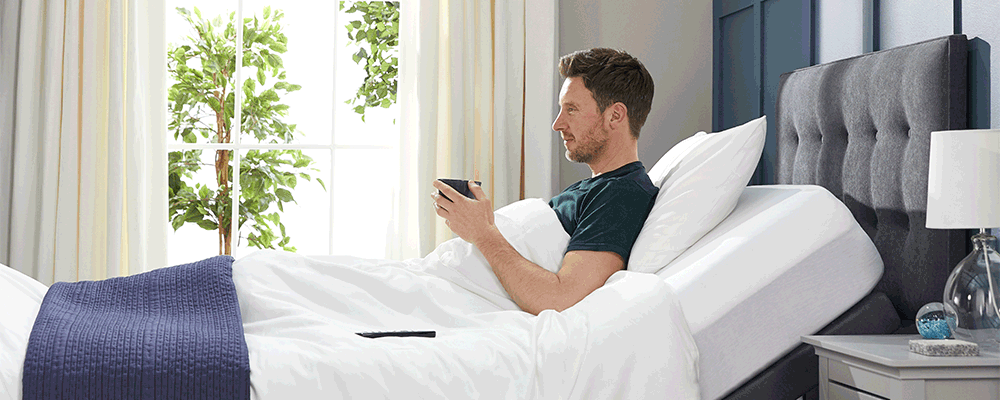 a man in bed with massage feature on comfortable