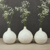 three round stem vases by Nona Kelhofer
