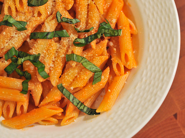 vodka sauce pasta on a white plate