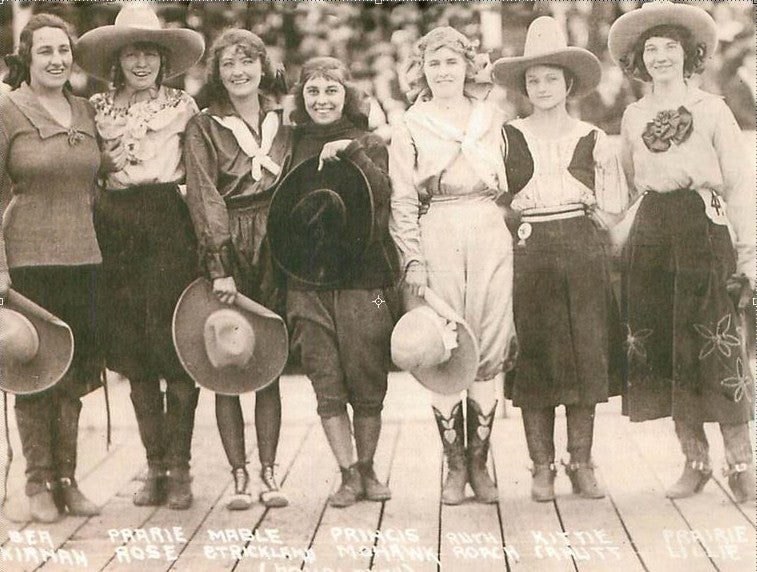 vintage cowgirls smiling at the camera