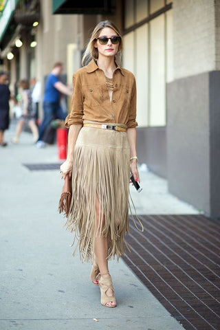 woman wearing tan fringed skirt