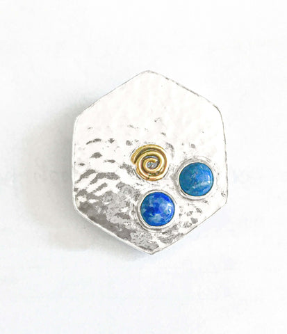 Large hexagonal brooch in textured fine silver, set with 2 lapis lazuli cabochons and a 9ct gold spiral