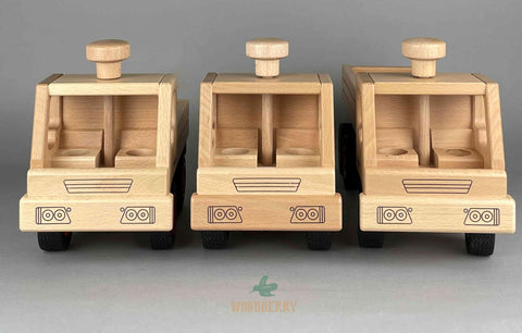 Fagus wooden toys from Germany. Truck comparison. Front view. Unimog/dump truck/container tipper truck