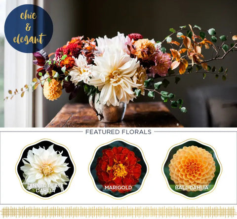 "A beautiful Thanksgiving flower centerpiece with autumn blooms and foliage."