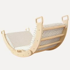 Sturdy arc rocker and climber, a creative indoor toy for active play during the festive season.