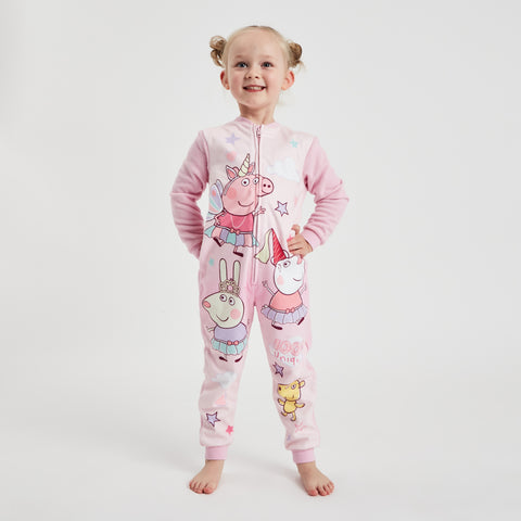 5 year old model wearing peppa pig all in one onesie, featuring pink sleeves and lighter pink body with images of peppa pig and susie sheep and friends