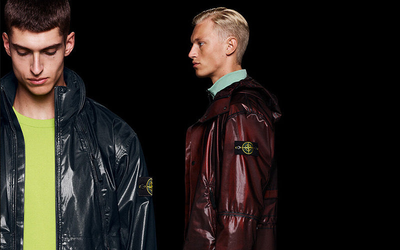 Stone Island is known for its iconic outerwear pieces, including garment dyed jackets and overshirt, complete with the signature compass logo emblem.