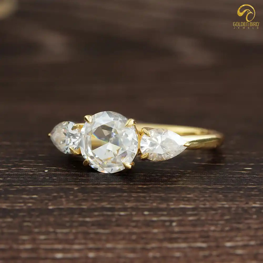 Yellow gold engagement ring in the antique cut Moissanite stones