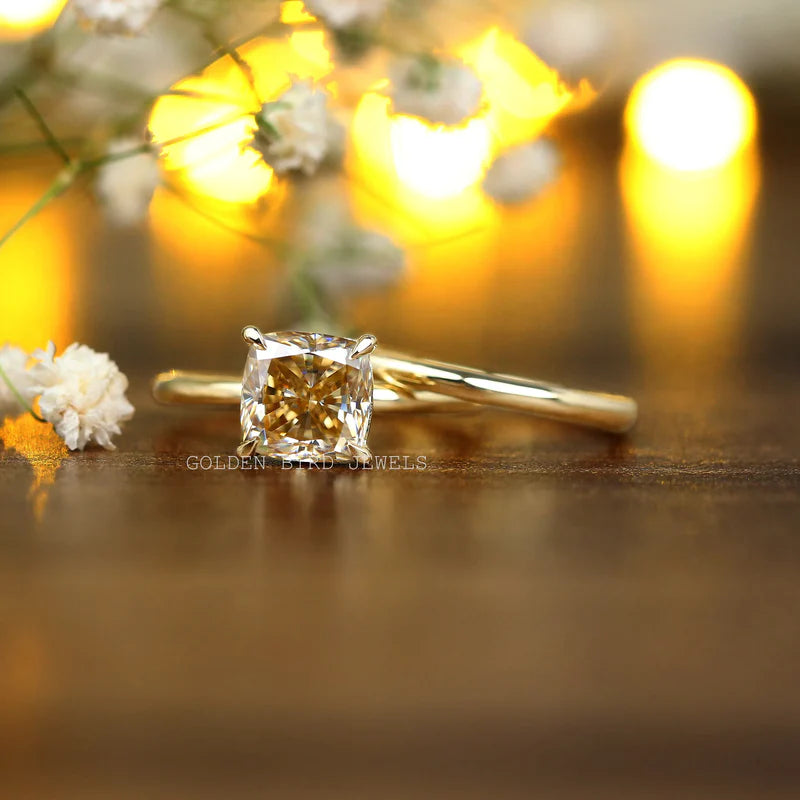 Brownish yellow cushion moissanite engagement ring set in 18KT yellow gold