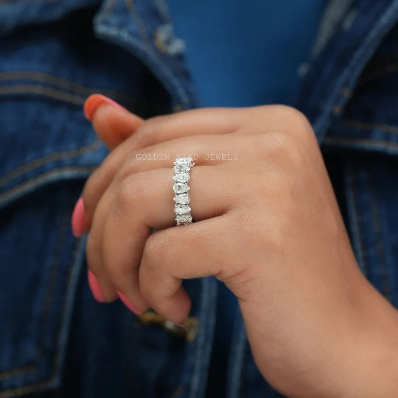 Wedding eternity band in white gold and pear shaped stones with prong settings