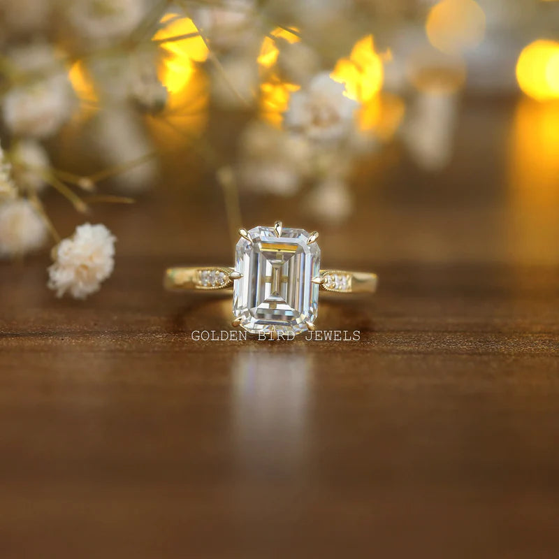 VVS clarity emerald cut moissanite engagement ring in simple art deco filigree work