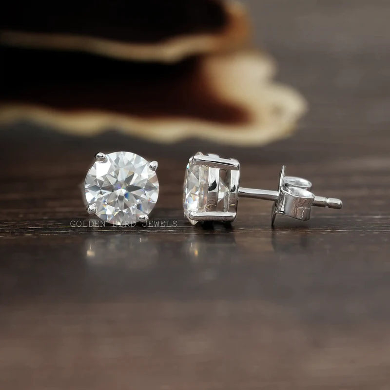 White gold stud earrings in round cut moissanite stones with a screw back style