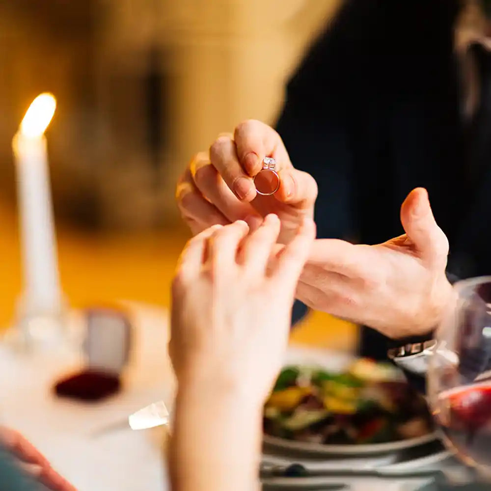 Man proposing woman with the ring