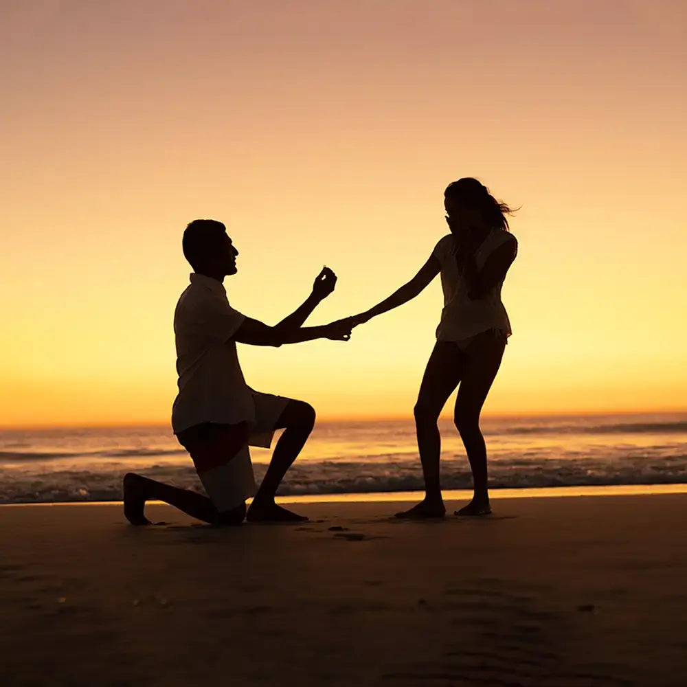 Wedding proposal on the beach at evening time with romance