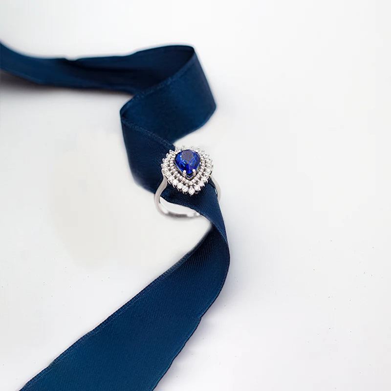 Blue sapphire gem engagement ring with a white gold band