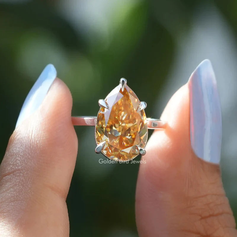5 carat yellowish champagne pear shaped moissanite solitaire engagement ring in 18KT yellow gold