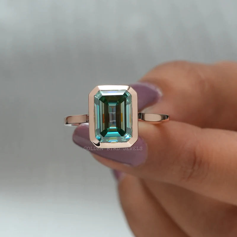 4.50 carat weighted blue colored emerald cut moissanite solitaire ring for her in rose gold metal