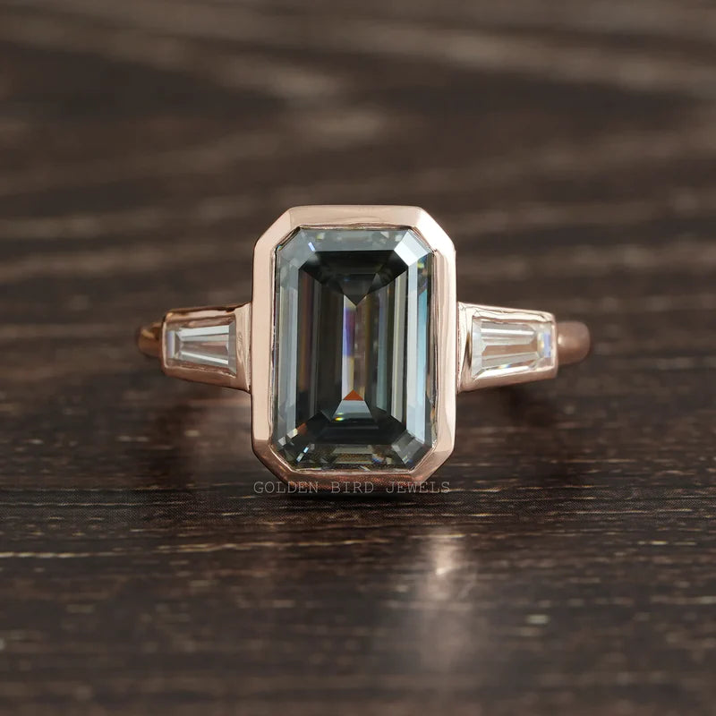 5.40 carat fancy dark grey colored emerald step cut moissanite three-stone ring in 18KT rose gold