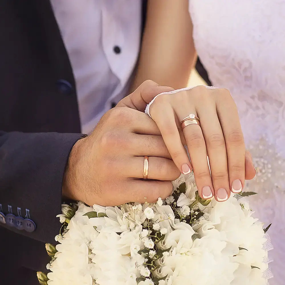 Bride and groom exchanged a wedding ring at marriage ceremony