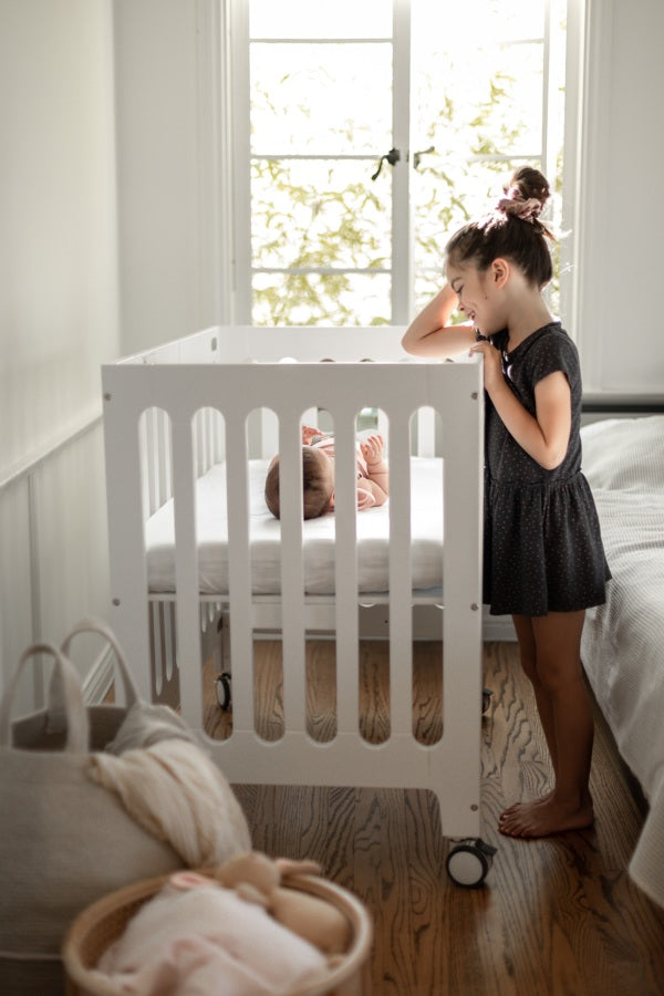 alma mini plus white crib with big sister