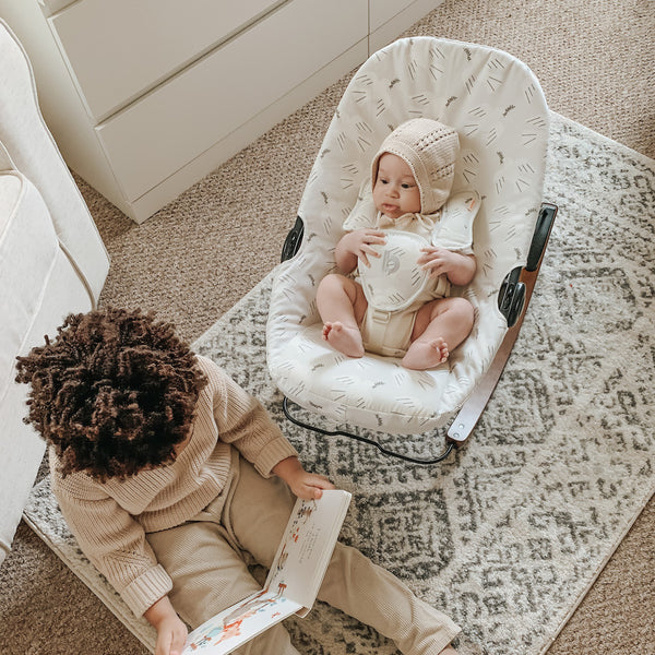 brother and baby in doves coco go bouncer