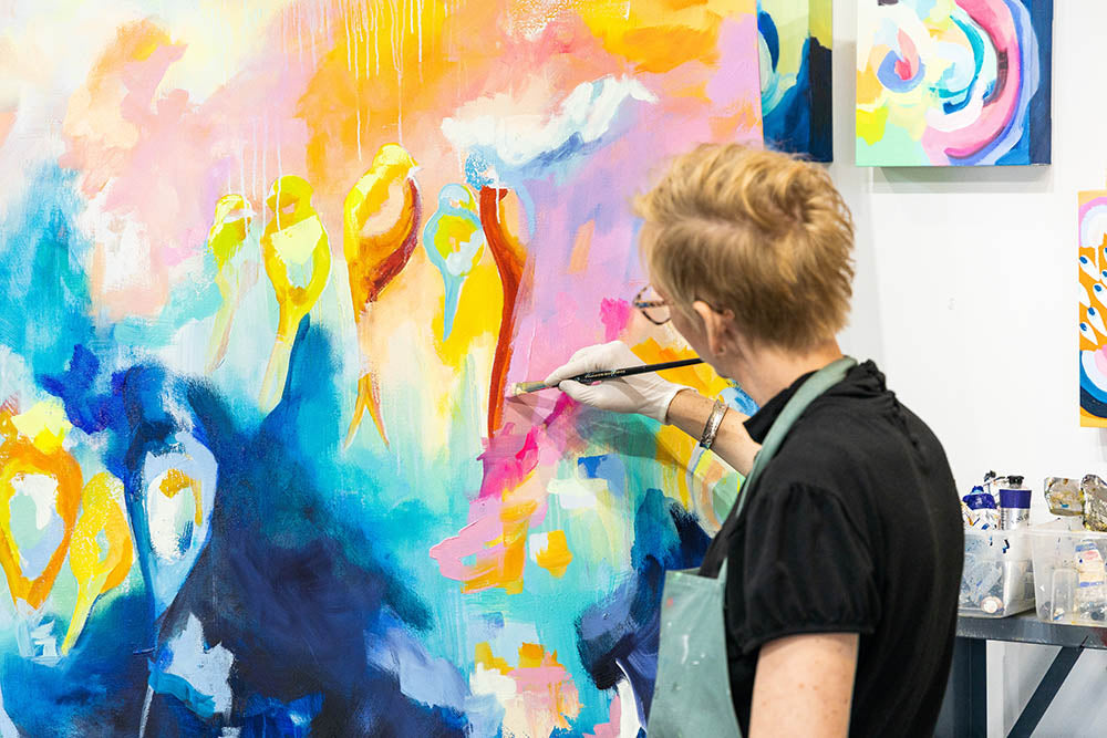 Suze Ford painting in her studio