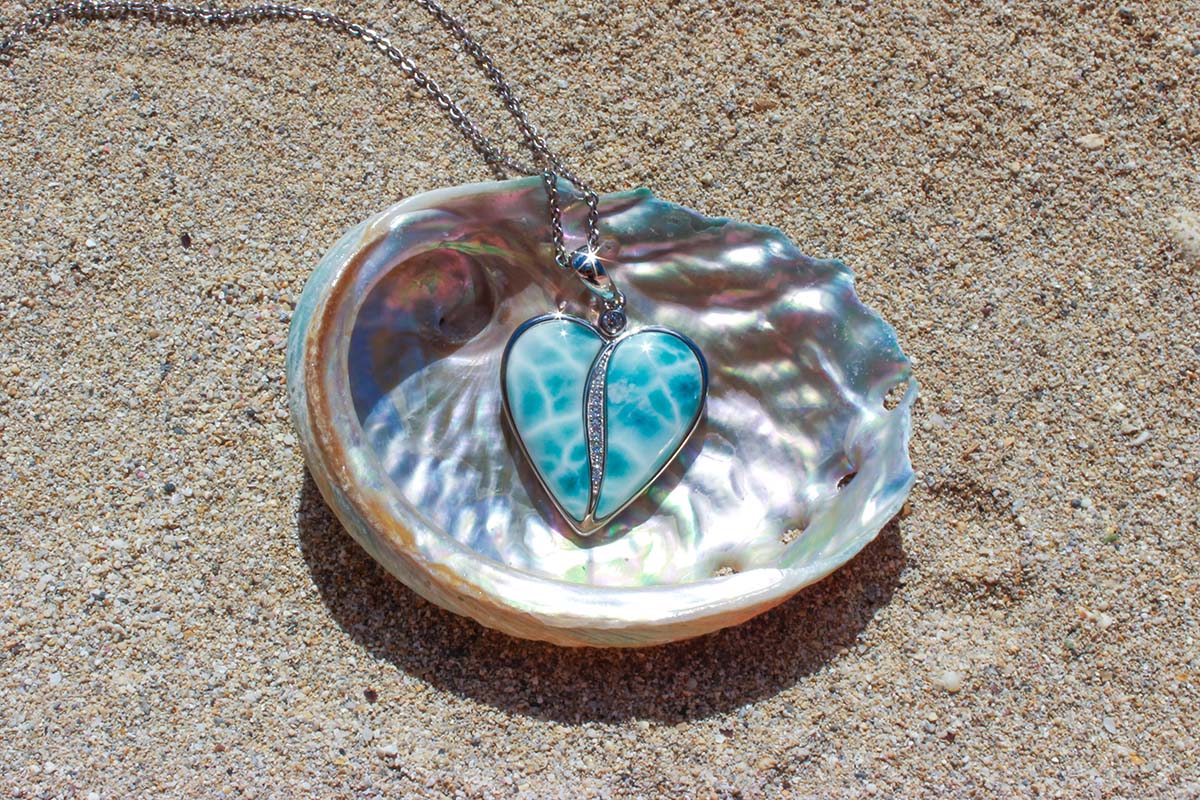 sterling silver Larimar Blue Pendant featuring the hanalei heart motif with white topaz gemstones lined up in the center