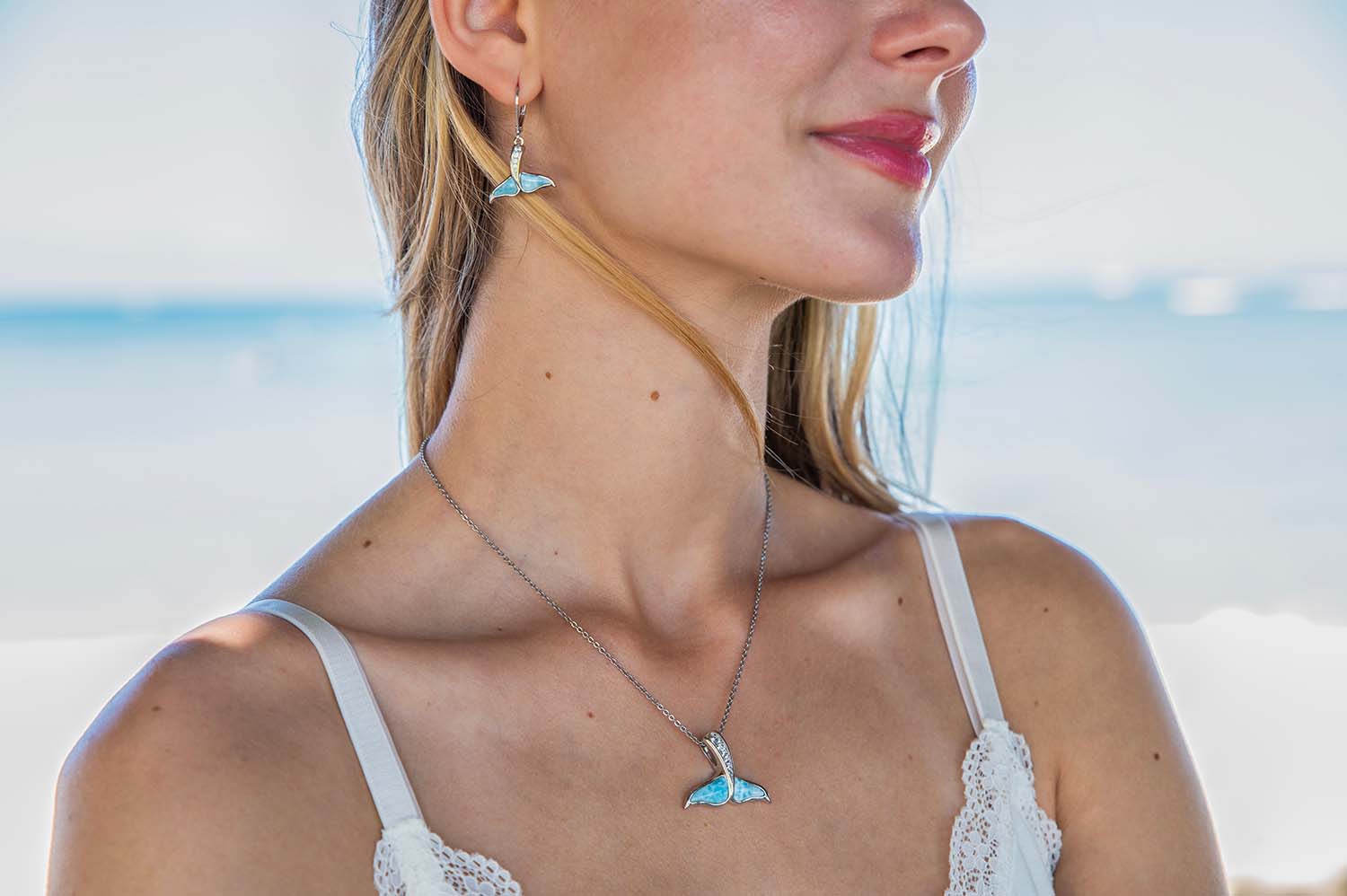 Larimar Whale Tail Set with lever back earrings on the left and pendant with earrings on the right