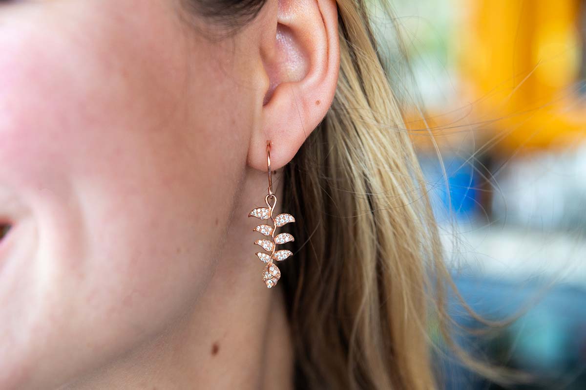 Heliconia Flower hook earrings paved with white topaz gemstones set in 14K rose gold vermeil and sterling silver