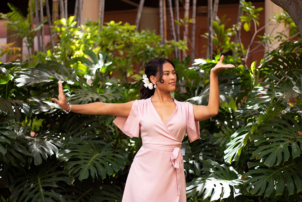 a woman in pink posing in Cambodian dance