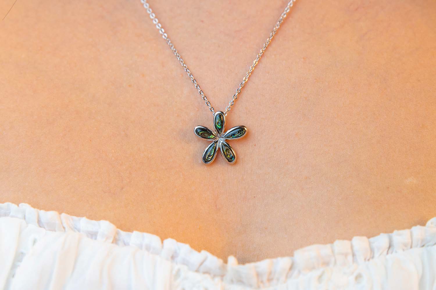 sterling silver pikake or Hawaiian Jasmine flower pendant in iridescent abalone