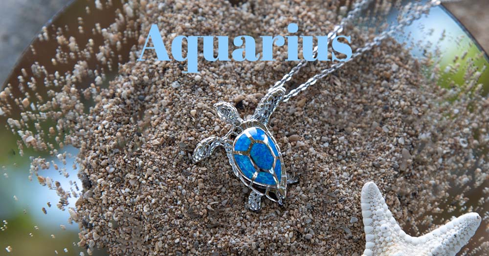 opalite tidepool sea turtle pendant on beach sand