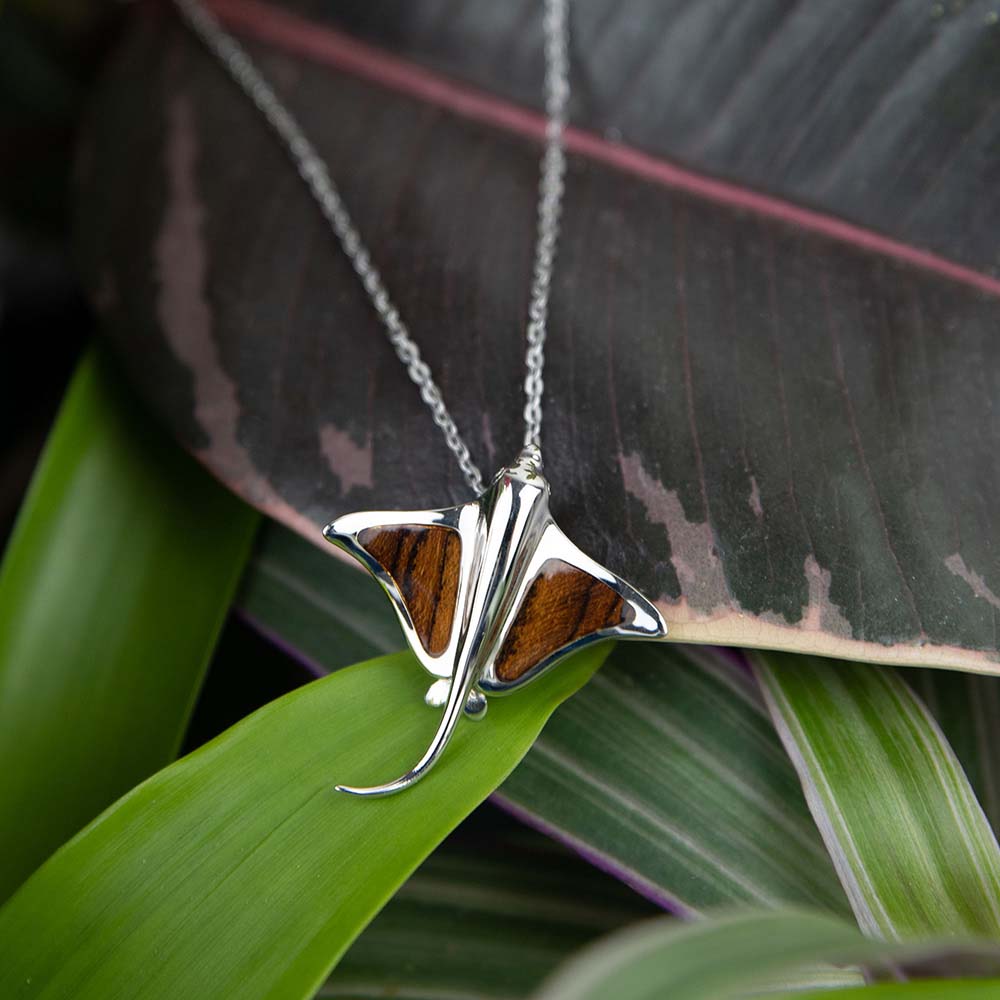 sterling silver eagle ray pendant featuring exotic brown Bocote wood with dark patterns 