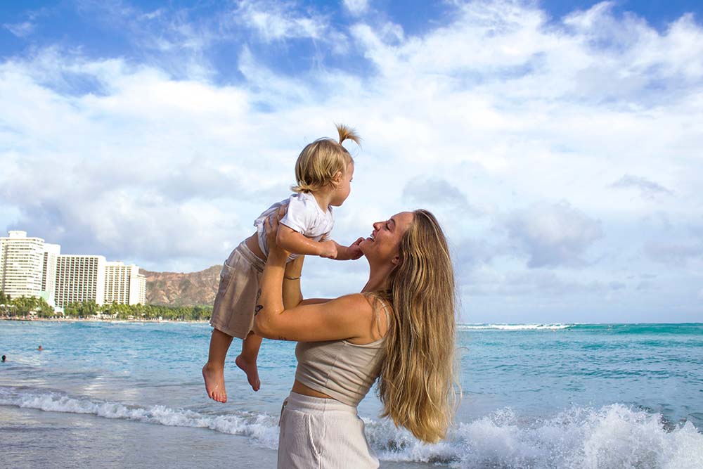 Mother and child with the view of diamond head and waikiki beach on the background