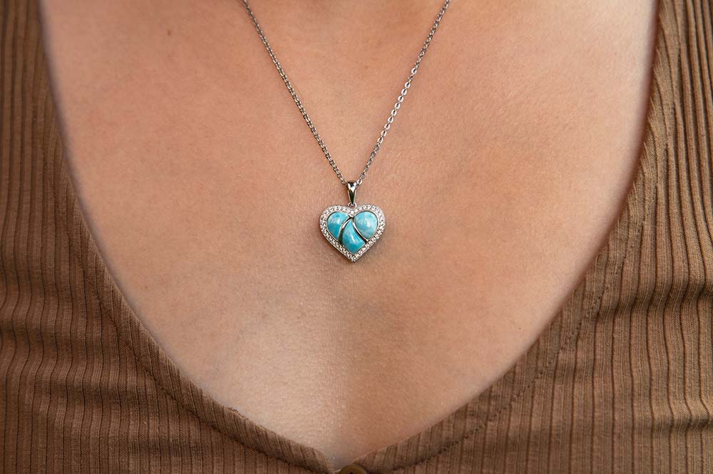 ocean blue larimar sweetheart pendant on a model