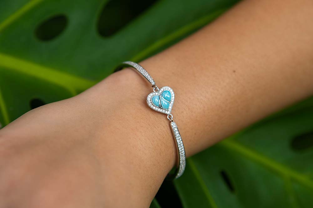 ocean blue larimar heart bracelet with diamonds on a model's wrist