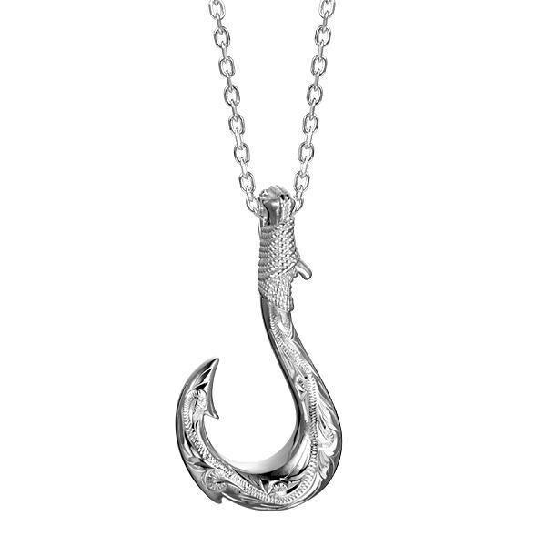 In this photo there is a sterling silver fish hook pendant with hand-engravings.