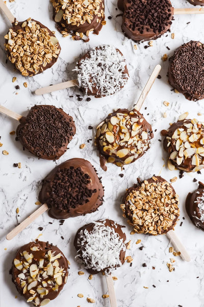 chocolate dipped apples recipe- halved apples coated in chocolate and toppings like nuts and coconut