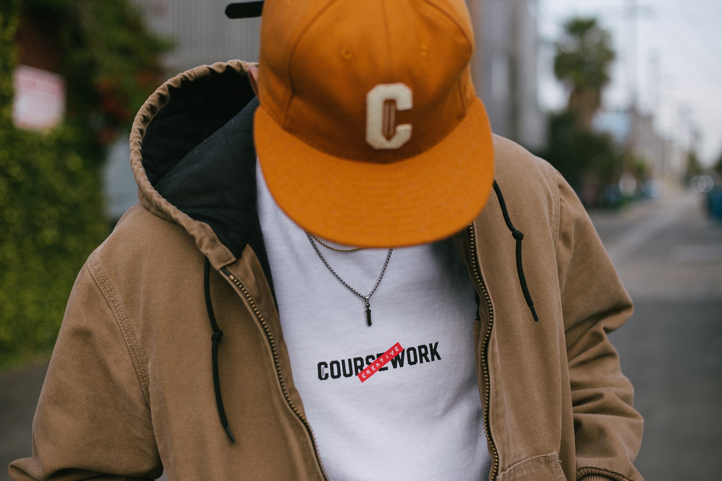 Model wearing the Creative Label tee and Ebbets Wool C Cap in Camel