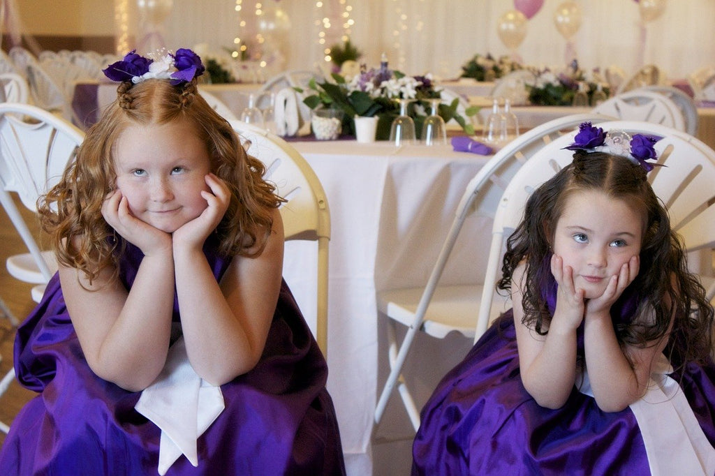 flower girls in purple dresses